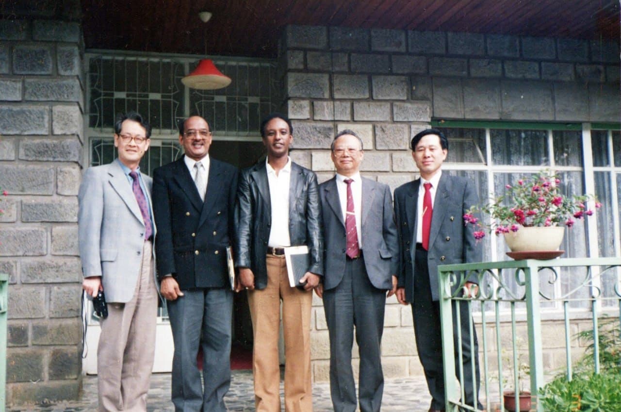 A group photographed outside the Dama premises
